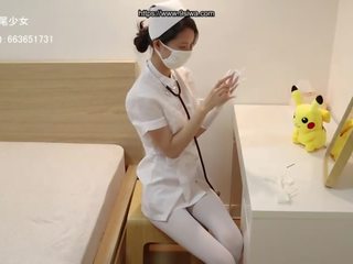 Китаянка медсестра зв’язування