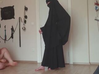Muslim young lady canes fat slave