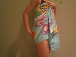 Young Striptease in Beach Towel