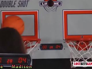 Two enchanting girls play a game of strip basketball shootout