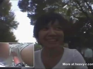 Asian babe rides fuck bike outdoors